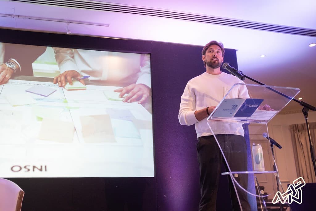 A speaker at a lectern during a Digital Greenhouse Guernsey event