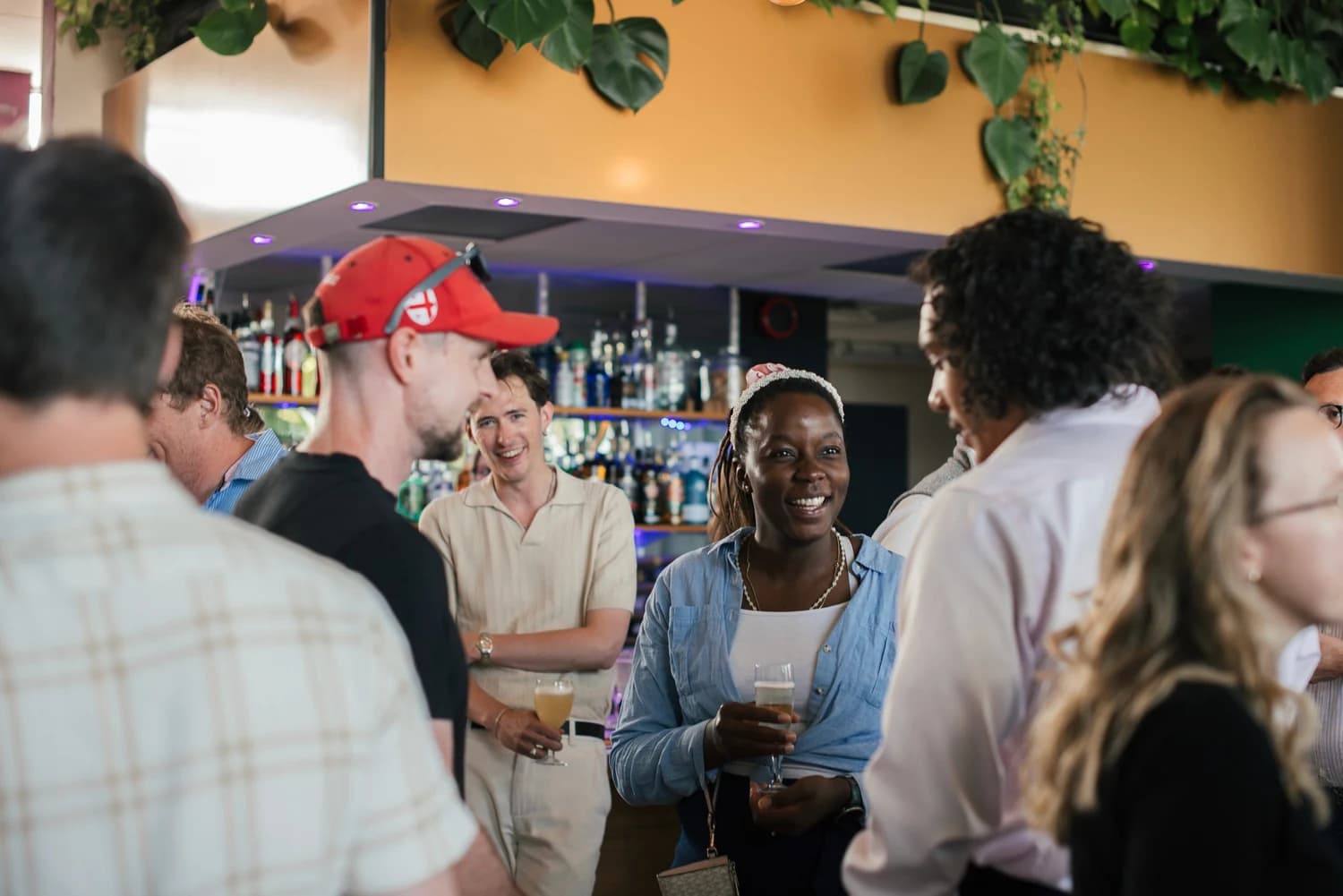 Guests chatting at INSO’s 2025 summer party.